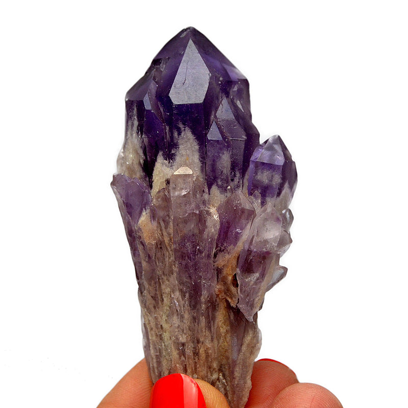 One elestial amethyst stone on hand with white background