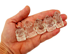 Five mini clear quartz ganesha sculptures 30mm-35mm on hand with white background