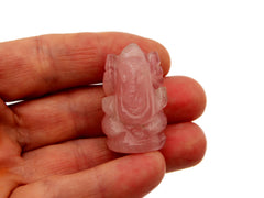 One mini pink quartz ganesha 30mm on hand with white background