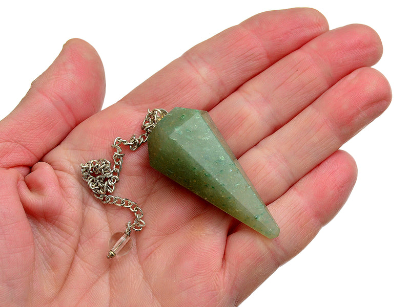 One green aventurine pendulum with silver chain on hand with white background