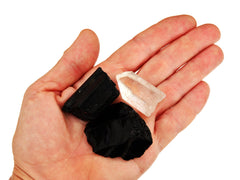 Raw black obsidian, clear quartz point and black tourmaline cathedral crystals 30mm-40mm on hand with white background