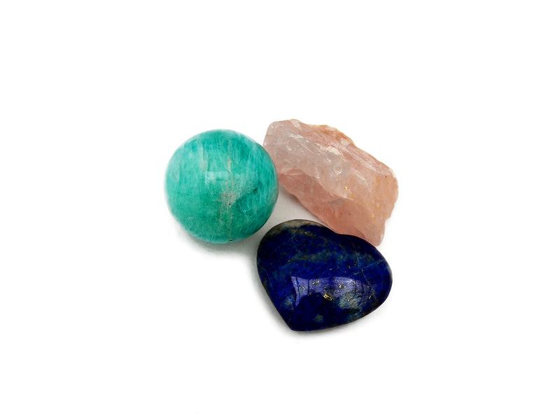 Raw rose quartz, amazonite sphere and lapis lazuli heart 30mm on white background