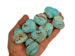 Eight small blue aragonite hearts 35mm-40mm on hand with white background