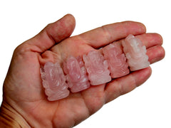 Five mini pink quartz ganesha figures 30mm-35mm on hand with white background