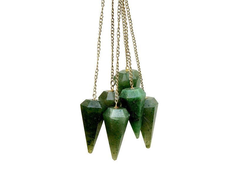 Some green aventurine faceted crystal pendulums with silver chain hanging on white background