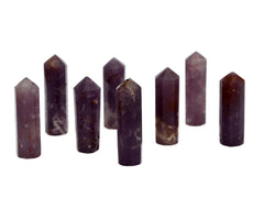 Eight purple lepidolite small points 55mm-60mm on white background