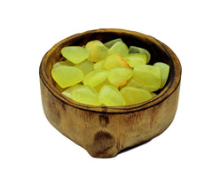 Several lemon calcite crystal hearts 25mm-30mm inside a bowl on white background