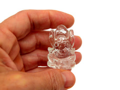 One mini clear quartz ganesha sculpture 35mm on hand with white background