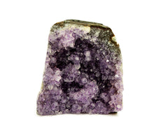 One druzy amethyst cut base 98mm on hand with white background