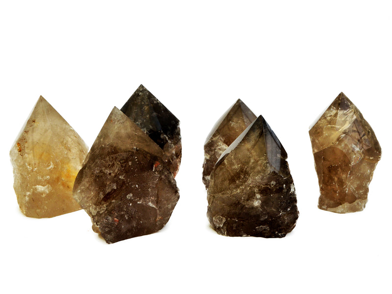 Six semi polished smoky quartz points 65mm-95mm on white background