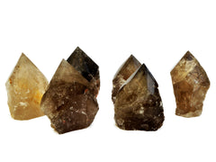 Six semi polished smoky quartz points 65mm-95mm on white background