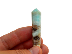 One blue aragonite point crystal 50mm on hand with white background