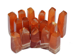 Several natural honey calcite crystal towers 60mm-90mm on white background