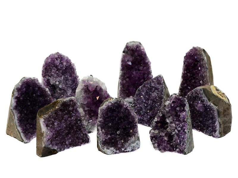 Some natural druzy amethyst cut base stones 60mm-110mm on white background