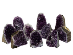 Some natural druzy amethyst cut base stones 60mm-110mm on white background