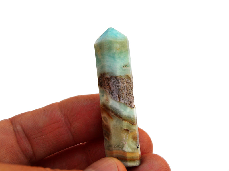 One small blue aragonite point crystal 50mm on hand with white background