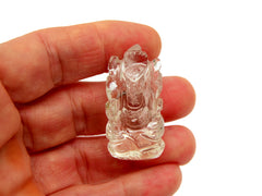 One mini clear quartz ganesha sculpture 35mm on hand with white background