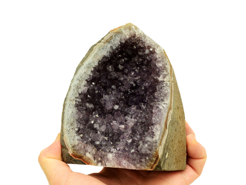One lavender druzy amethyst cut base 110mm on hand with white background