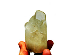 One crystal quartz cluster cylinder 55mm on hand with white background