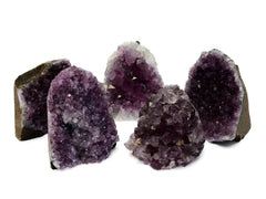 Five druzy amethyst cut base crystals 65mm - 80mm on white background