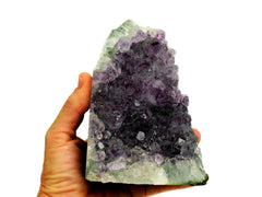 One purple druzy amethyst cut base 120mm on hand with white background
