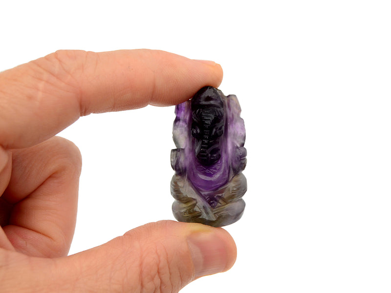 One mini amethyst ganesha figure 35mm on hand with white background