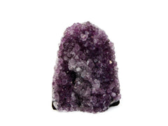 One large purple druzy amethyst cut base on white background