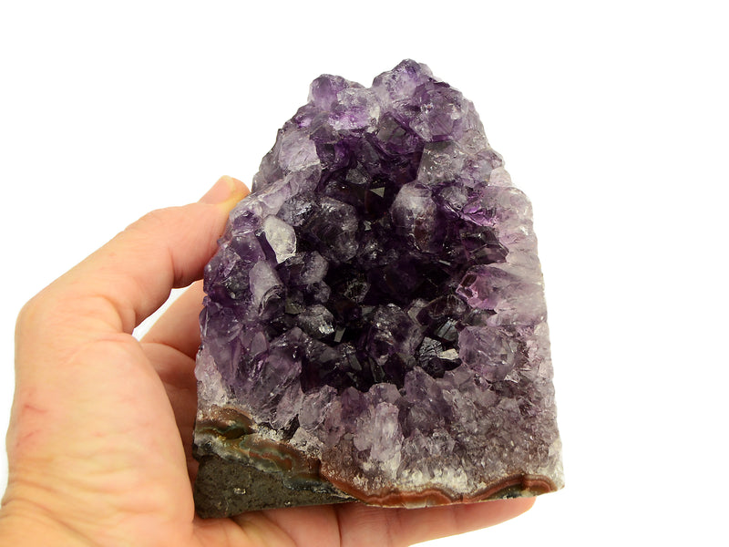 One druzy amethyst cut base 100mm on hand with white background