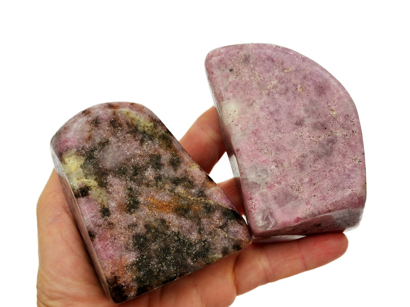 Two lepidlote free form stones 80mm-90mm on hand with white background