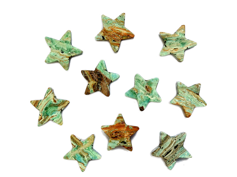 Several natural blue aragonite stars 60mm on white background