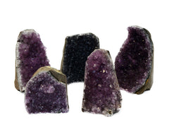 Five druzy amethyst cut base stones 70mm-110mm on white background