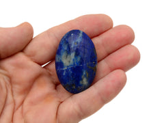 Mini lapis lazuli palm stone 40mm on hand with white background