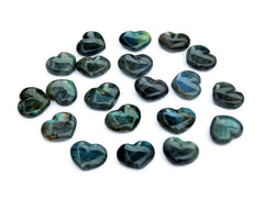 Several flash labradorite puffy heart crystals 30mm on white background
