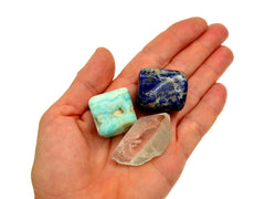 One lapis lazuli tumbled, rough clear quartz point and blue aragonite tumbled stone 20mm-30mm on hand with white background