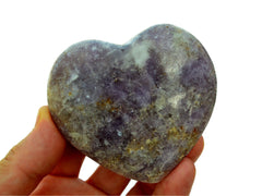 One lepidolite crystal heart 75mm on hand with white background