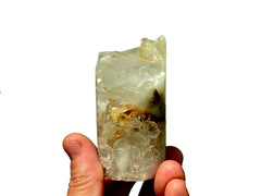 One crystal quartz cluster cylinder 75mm on hand with white background