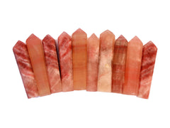 Ten rose calcite faceted tower points 55mm-65mm on white background