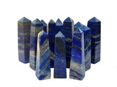 Several blue lapis lazuli crystal towers 80mm-100mm on white background