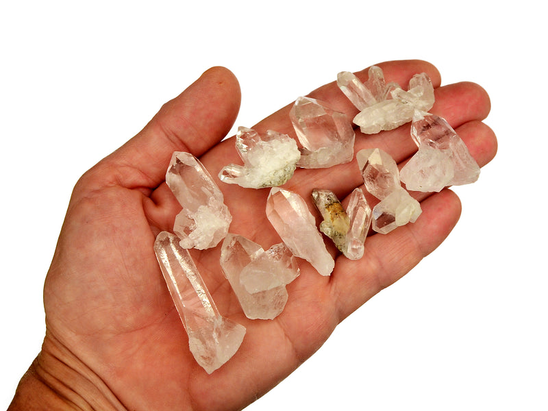 Some mini clear quartz druzies 30mm on hand with white background