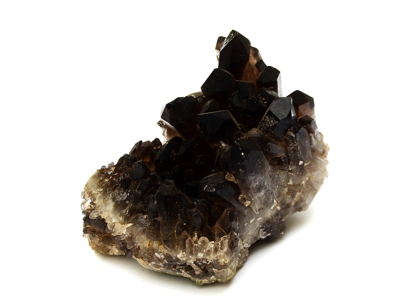 Smoky quartz druzy specimen on a white background