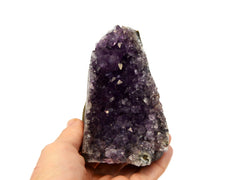 One purple druzy amethyst cut base 110mm on hand with white background