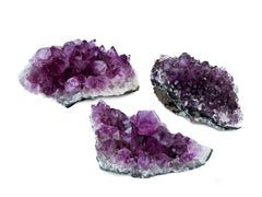 Three purple amethyst crystal clusters 100mm-120mm on white background
