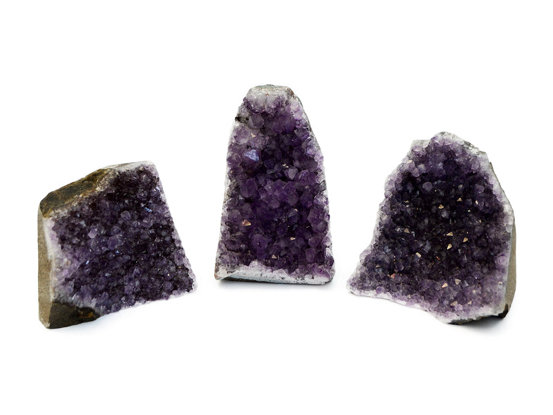 Three druzy amethyst cut base on white background