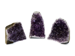 Three druzy amethyst cut base on white background