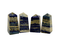 Four lapis lazuli obelisk stones 60mm on white background