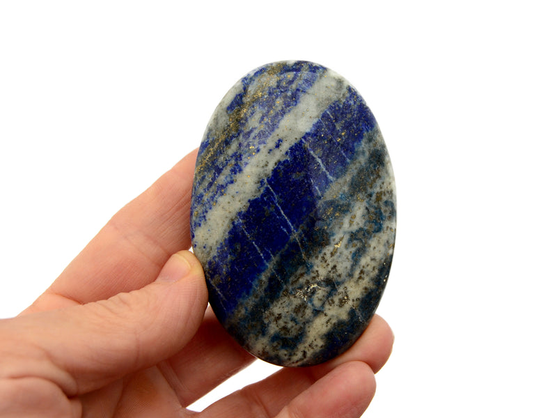 One large  lapis lazuli palm stone 75mm on hand with white background