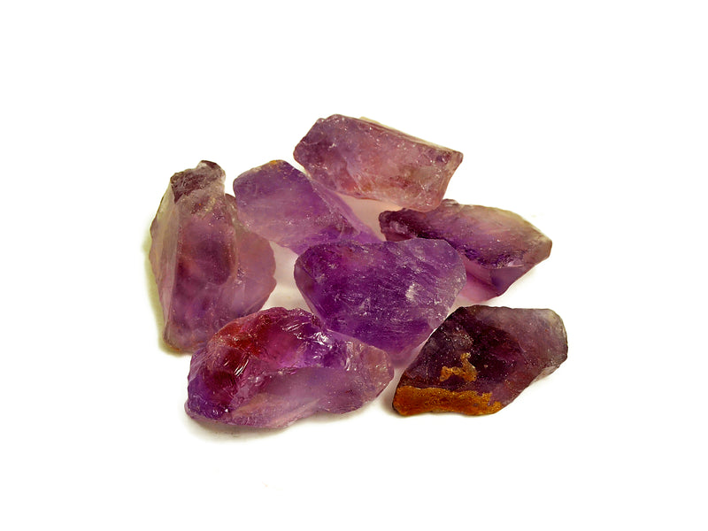 Seven raw amethyst crystals 30mm-40mm on white background