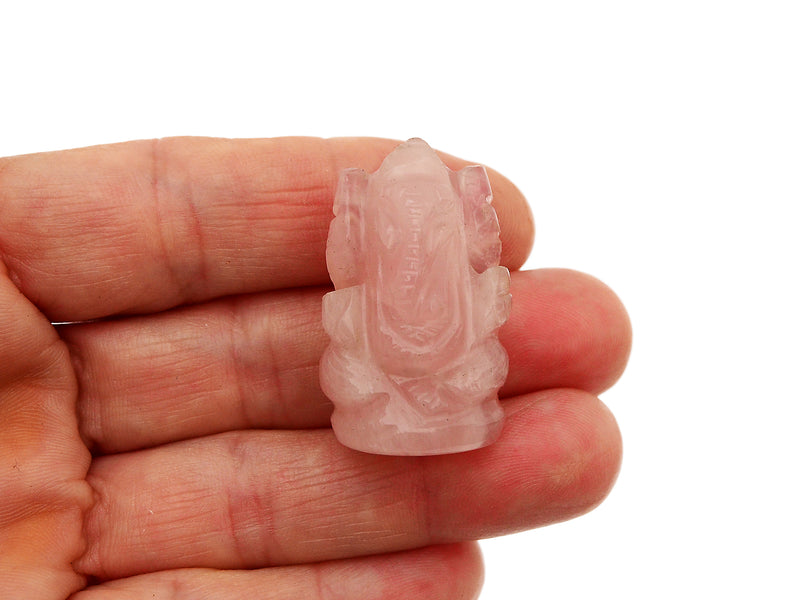 One mini rose quartz ganesha 30mm on hand with white background