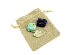 Blue aragonite tumbled, raw clear quartz point and lapis lazuli tumbled 20mm-30mm on natural jute bag