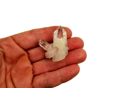 One mini clear quartz druzy 30mm on hand with white background